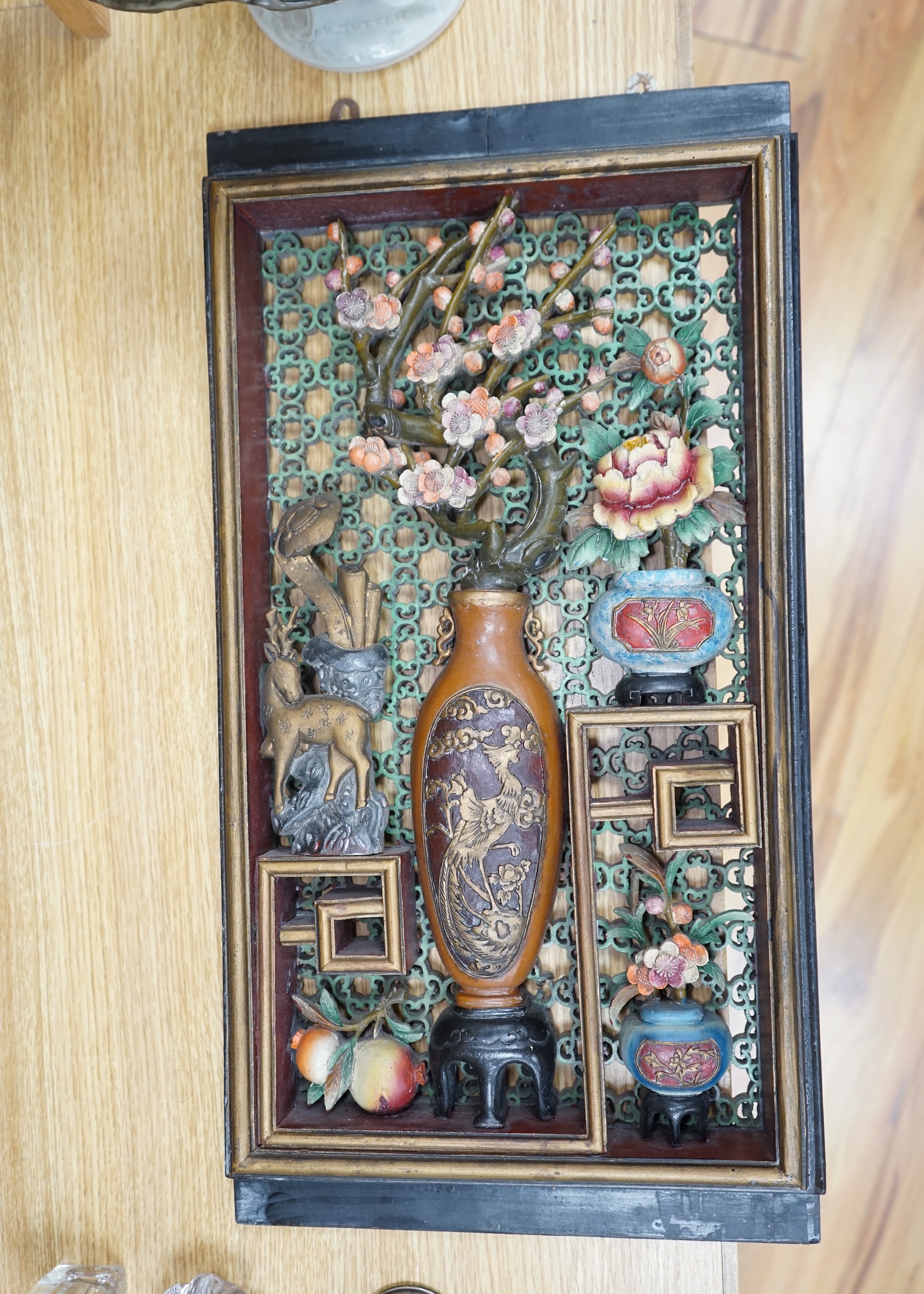 A Chinese polychrome painted carved wood wall panel, 59.5 x 31cm. Condition - fair to good